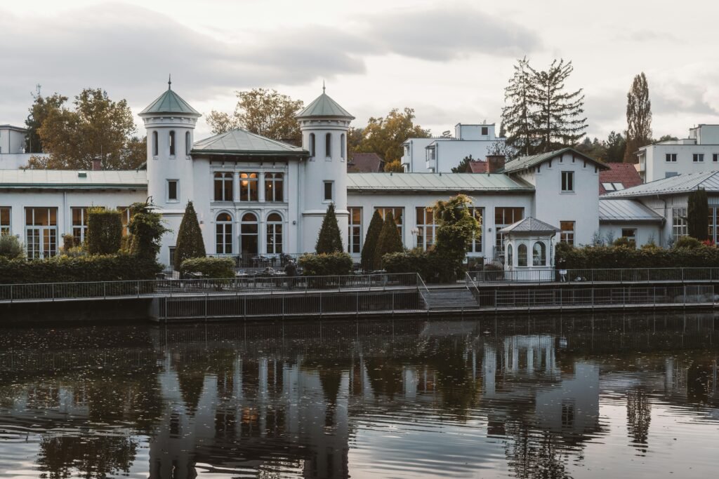 Elegant riverside mansion with garden reflections